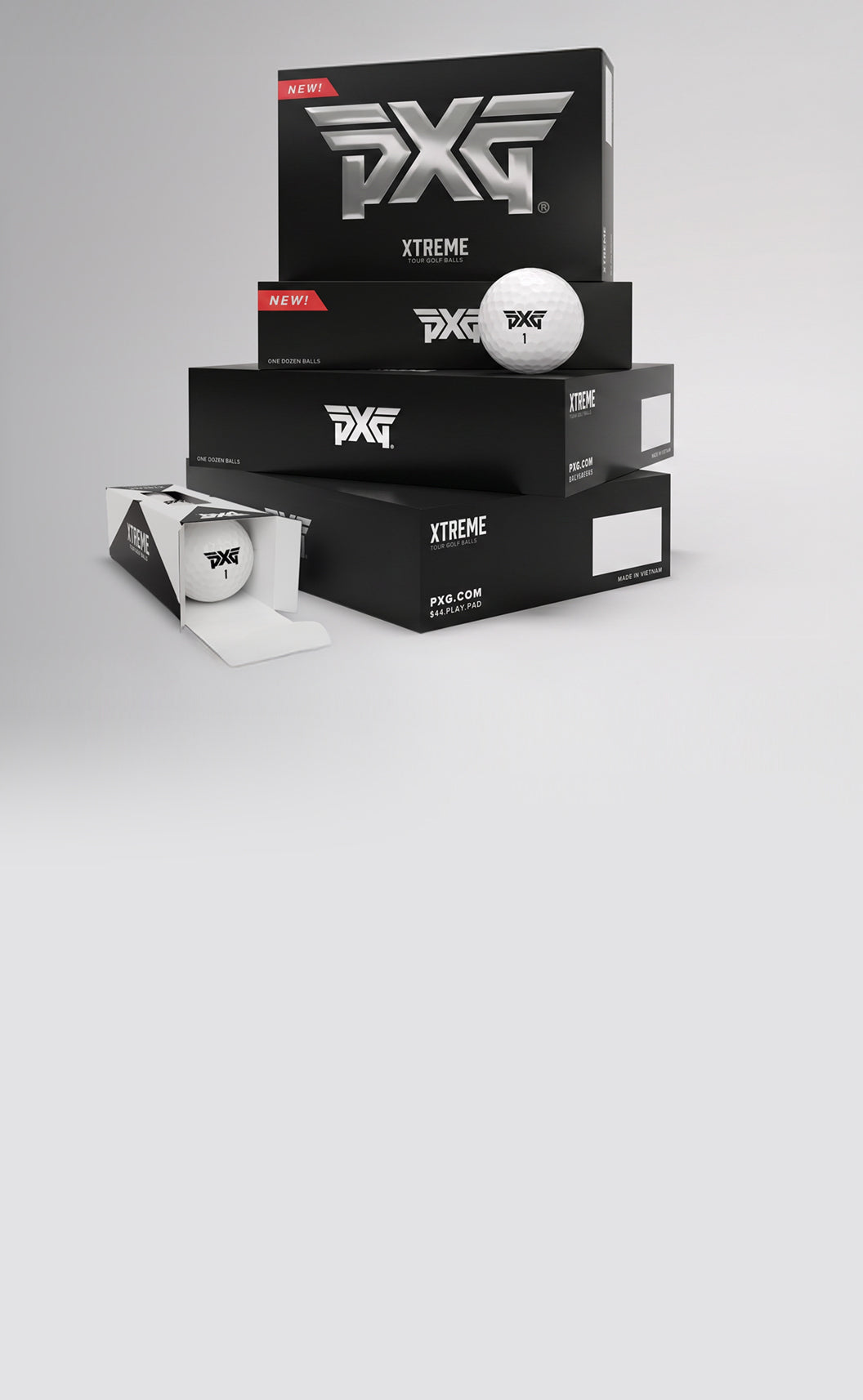 PXG golf balls and packaging on a gray background