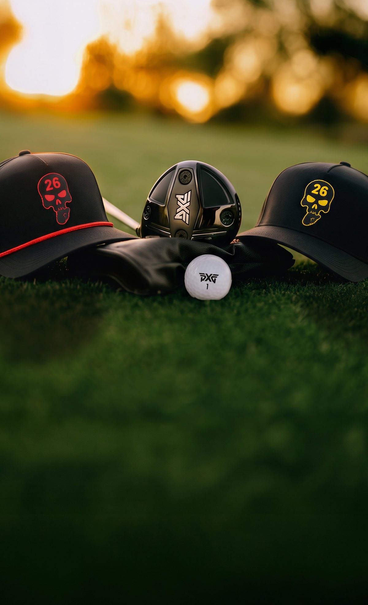 Hats and Mini Driver PXG on a golf ball and grass