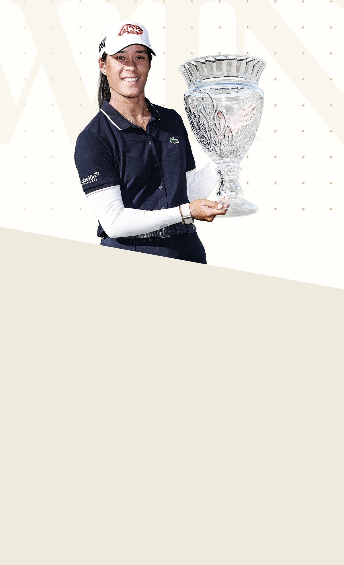 Woman holding a trophy for a golf tournament that she won