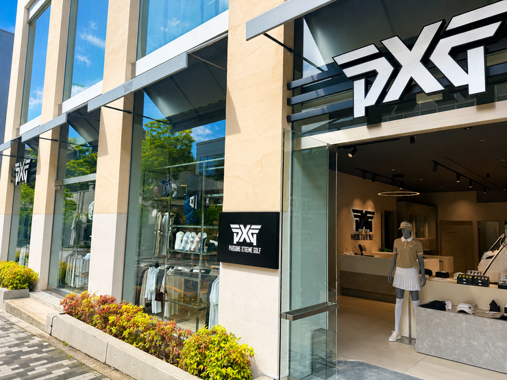 PXG golf store exterior with glass entrance and branding