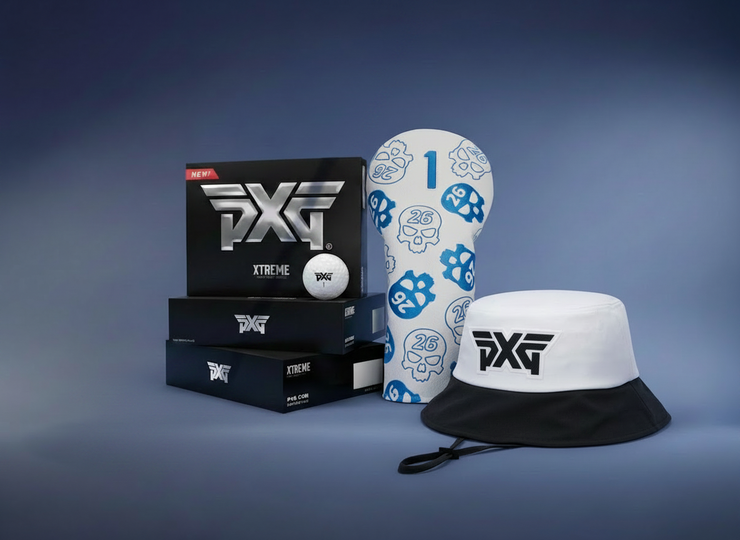 PXG golf accessories including hat, ball, and packaging on a blue background