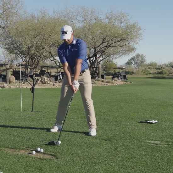 Aldrich Potgieter swinging a golf club on a golf course.