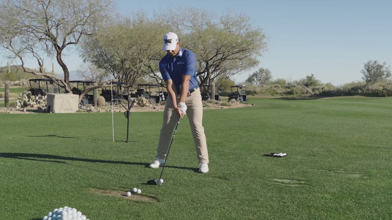 Aldrich Potgieter swinging a golf club on a golf course.